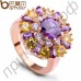 Живописное позолоченное кольцо с фиолетовыми и цвета шампанского камнями в обрамлении 18-каратных фианитов