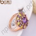Живописное позолоченное кольцо с фиолетовыми и цвета шампанского камнями в обрамлении 18-каратных фианитов
