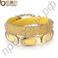 Браслет четырех цветов из натуральной кожи в виде двух обручей с металлическими вставками по периметру