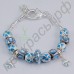 Нежный браслет голубого цвета с милыми цветочками и двумя сердечками в серебряном исполнении